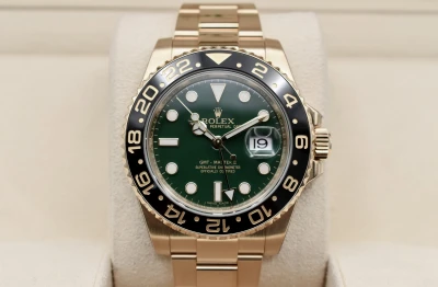 Rolex GMT Master ll 18ct Yellow Gold Green Dial 40mm Watch 116718LN