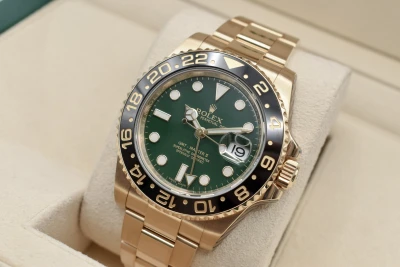 Rolex GMT Master ll 18ct Yellow Gold Green Dial 40mm Watch 116718LN